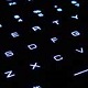 Illuminated keyboard keys lit up close view